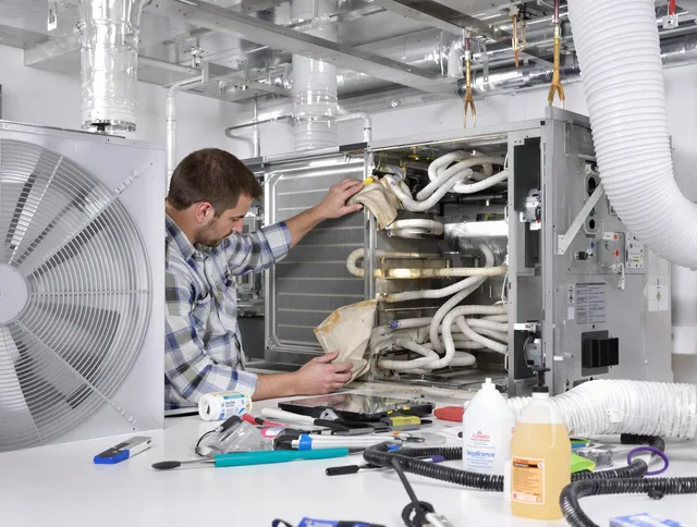 Whitman Air Duct Cleaning specialist performing precision AC coil cleaning in Whitman