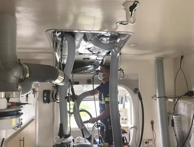 Whitman Air Duct Cleaning specialist performing precise mobile home duct cleaning in Whitman
